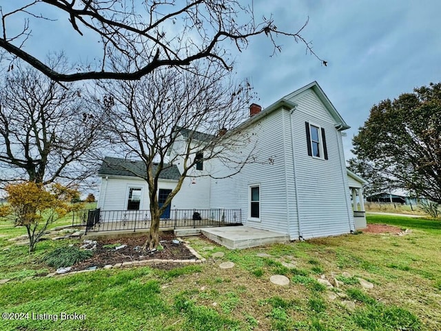 3743 Lincoln Park Rd, Springfield, KY 40069 - back of house with a chimney and a yard