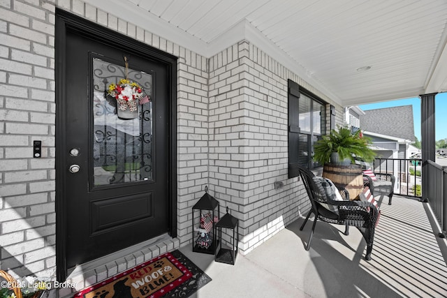213 Elegance Way, Elizabethtown, KY 42701 - doorway to property with covered porch and brick siding