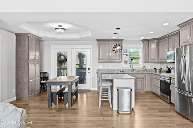 213 Elegance Way, Elizabethtown, KY 42701 - kitchen featuring stainless steel appliances, a breakfast bar area, light stone countertops, light wood finished floors, and recessed lighting