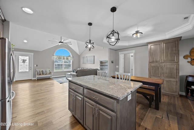 213 Elegance Way, Elizabethtown, KY 42701 - kitchen featuring freestanding refrigerator, ceiling fan, a center island, open floor plan, and dark wood-type flooring