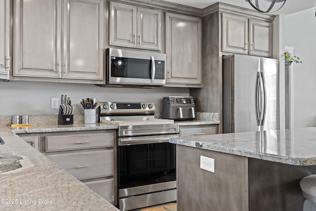 213 Elegance Way, Elizabethtown, KY 42701 - kitchen featuring appliances with stainless steel finishes and light stone countertops