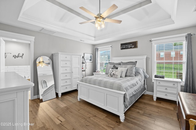 213 Elegance Way, Elizabethtown, KY 42701 - bedroom featuring a tray ceiling, dark wood-type flooring, crown molding, ceiling fan, and baseboards