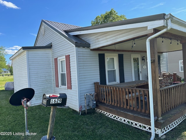 1629 Bardstown Rd, Hodgenville, KY 42748 - view of home's exterior with a porch and a yard