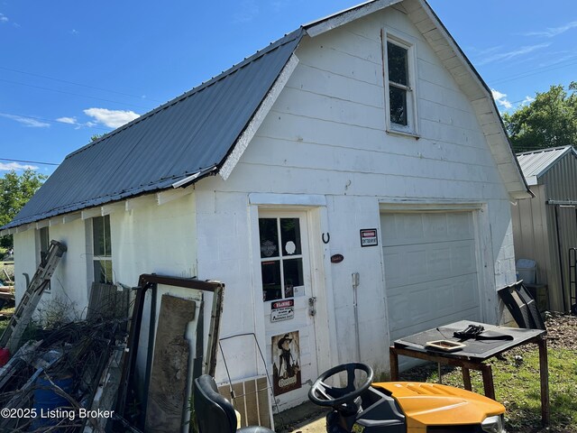 1629 Bardstown Rd, Hodgenville, KY 42748 - back of property featuring metal roof, a gambrel roof, an outdoor structure, and a barn