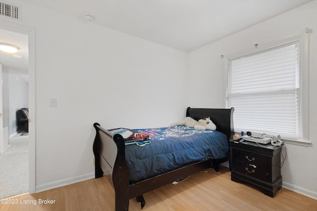 7917 Edsel Ln, Louisville, KY 40291 - bedroom featuring baseboards and light wood-style floors
