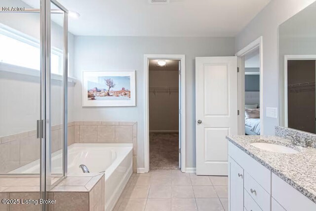 6512 Fair Ridge Ln, Louisville, KY 40291 - full bath featuring a spacious closet, vanity, a bath, tile patterned floors, and a stall shower