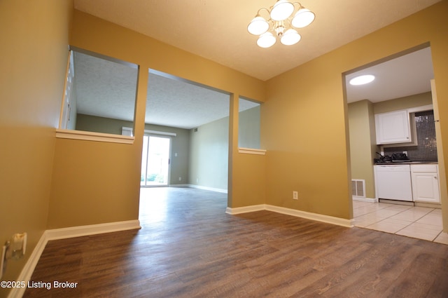 1116 La Fontenay Ct, Louisville, KY 40223 - spare room featuring light wood-type flooring, a chandelier, and baseboards