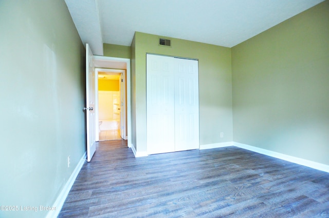 1116 La Fontenay Ct, Louisville, KY 40223 - unfurnished bedroom with wood finished floors, baseboards, and a closet