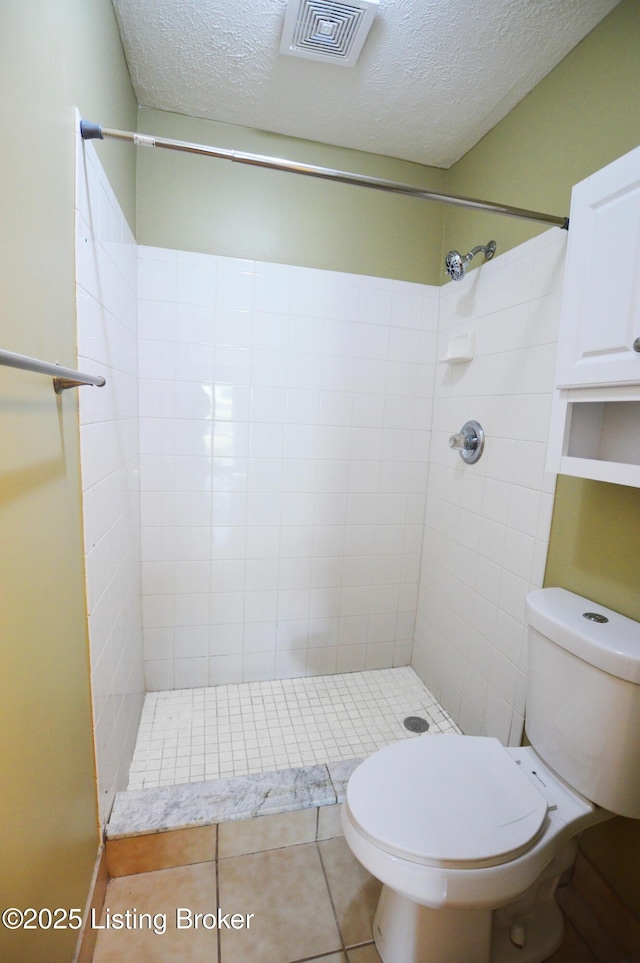 1116 La Fontenay Ct, Louisville, KY 40223 - full bath with a textured ceiling, tiled shower, toilet, and tile patterned floors