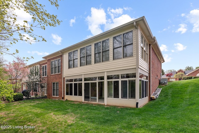 10121 Cave Creek Rd, Louisville, KY 40223 - rear view of property with a lawn and brick siding