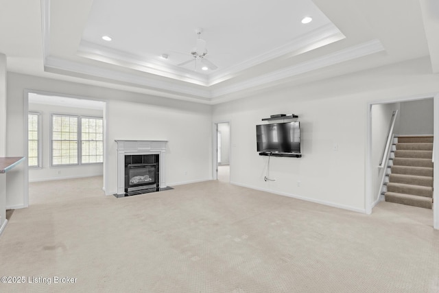 10121 Cave Creek Rd, Louisville, KY 40223 - unfurnished living room featuring a tray ceiling, stairs, baseboards, recessed lighting, and a fireplace
