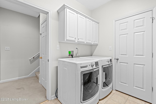 10121 Cave Creek Rd, Louisville, KY 40223 - laundry area featuring separate washer and dryer, cabinet space, and baseboards