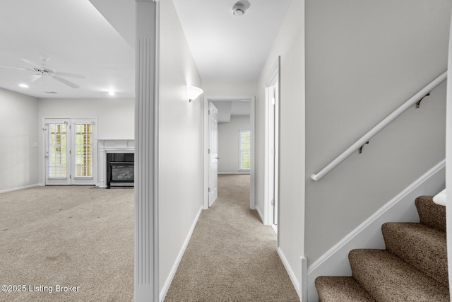 10121 Cave Creek Rd, Louisville, KY 40223 - hallway with carpet floors, baseboards, and stairway