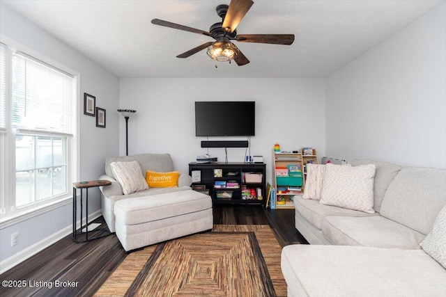 254 Persell Rd, Bedford, KY 40006 - living room with dark wood-style floors, a ceiling fan, and baseboards