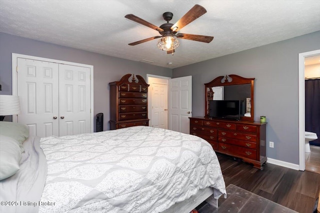 254 Persell Rd, Bedford, KY 40006 - bedroom featuring a closet, dark wood-style floors, baseboards, ceiling fan, and ensuite bathroom