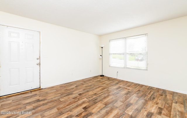 112 Bivins Ct, Radcliff, KY 40160 - unfurnished room with wood finished floors and baseboards
