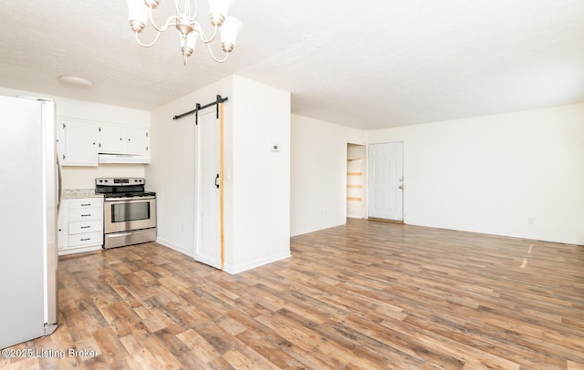 112 Bivins Ct, Radcliff, KY 40160 - kitchen with stainless steel electric range oven, freestanding refrigerator, a barn door, light wood finished floors, and white cabinets