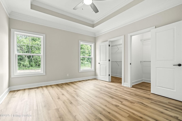 5311 Lee Ave, Crestwood, KY 40014 - unfurnished bedroom with light wood-style floors, ornamental molding, a spacious closet, and baseboards