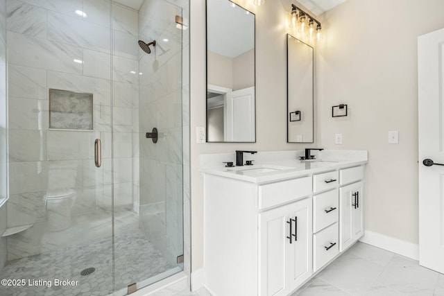 5311 Lee Ave, Crestwood, KY 40014 - bathroom featuring marble look tile flooring, baseboards, a shower stall, double vanity, and toilet
