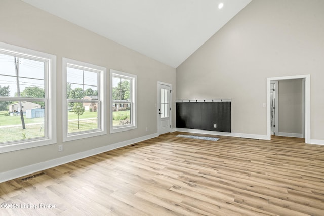 5311 Lee Ave, Crestwood, KY 40014 - unfurnished living room with high vaulted ceiling, light wood-style flooring, and baseboards