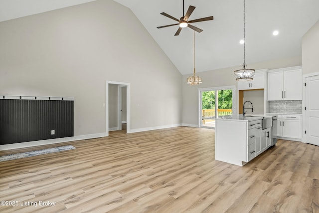 5311 Lee Ave, Crestwood, KY 40014 - kitchen with high vaulted ceiling, open floor plan, a sink, ceiling fan, and white cabinets