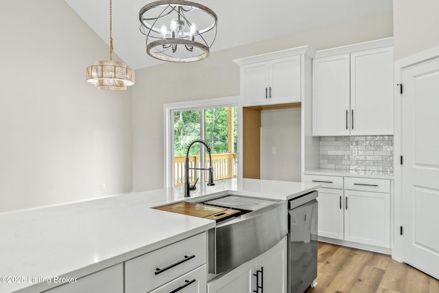 5311 Lee Ave, Crestwood, KY 40014 - kitchen with a chandelier, light countertops, white cabinets, tasteful backsplash, and decorative light fixtures