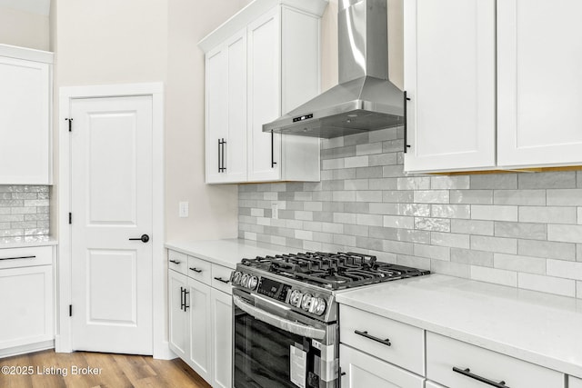5311 Lee Ave, Crestwood, KY 40014 - kitchen with wall chimney exhaust hood, gas range, white cabinetry, light countertops, and backsplash