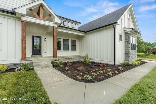 5311 Lee Ave, Crestwood, KY 40014 - property entrance with board and batten siding, covered porch, stone siding, and roof with shingles