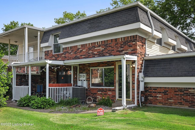 3104 Valleyside Ct, Louisville, KY 40214 - view of front of house with a porch, brick siding, and mansard roof