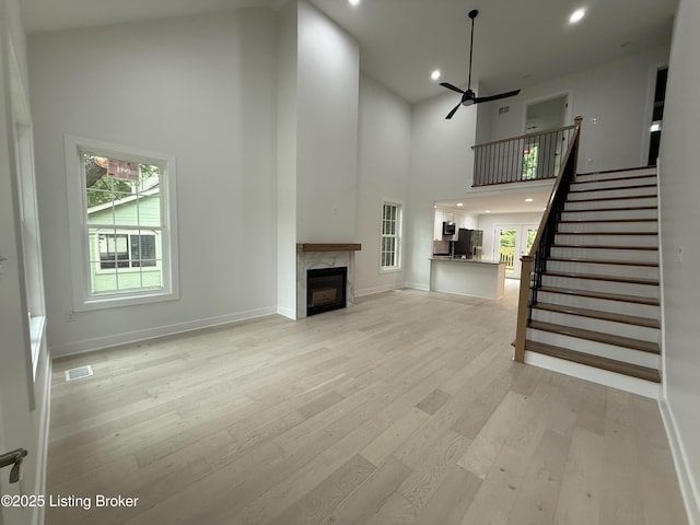 6702 Shirley Ave, Prospect, KY 40059 - unfurnished living room with a high ceiling, ceiling fan, light wood finished floors, recessed lighting, and stairs