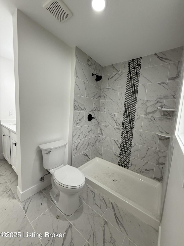 6702 Shirley Ave, Prospect, KY 40059 - full bath featuring marble look tile flooring, tiled shower, vanity, and toilet