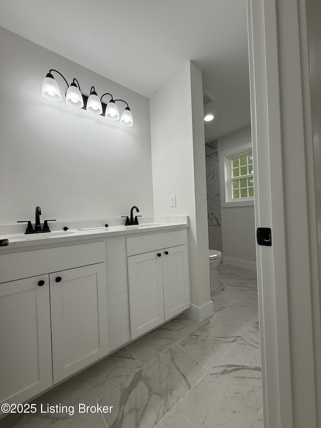 6702 Shirley Ave, Prospect, KY 40059 - full bath featuring marble finish flooring, toilet, double vanity, and baseboards
