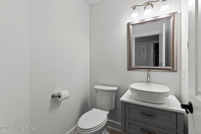6702 Shirley Ave, Louisville, KY 40059 - bathroom featuring vanity, toilet, and baseboards
