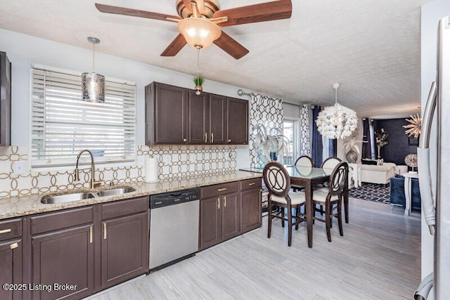 9505 River Trail Dr, Louisville, KY 40229 - kitchen featuring stainless steel appliances, a sink, dark brown cabinets, a ceiling fan, and tasteful backsplash