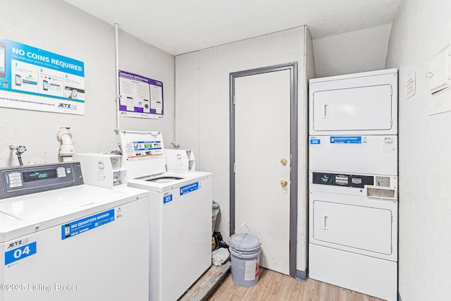3401 Lesway Ct, Louisville, KY 40220 - community laundry room featuring stacked washer / drying machine, light wood finished floors, and independent washer and dryer