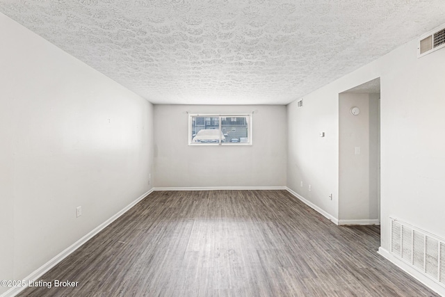 3401 Lesway Ct, Louisville, KY 40220 - empty room with wood finished floors, a textured ceiling, and baseboards