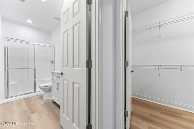 3447 Hurstbourne Ridge Blvd, Louisville, KY 40299 - full bath featuring a stall shower, wood finished floors, toilet, a spacious closet, and recessed lighting