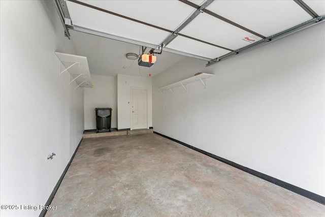 3447 Hurstbourne Ridge Blvd, Louisville, KY 40299 - garage featuring a garage door opener and baseboards