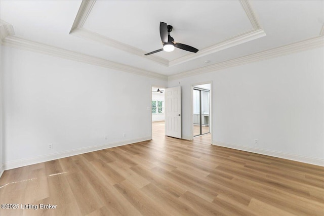 3447 Hurstbourne Ridge Blvd, Louisville, KY 40299 - spare room featuring a tray ceiling, ornamental molding, light wood finished floors, a ceiling fan, and baseboards