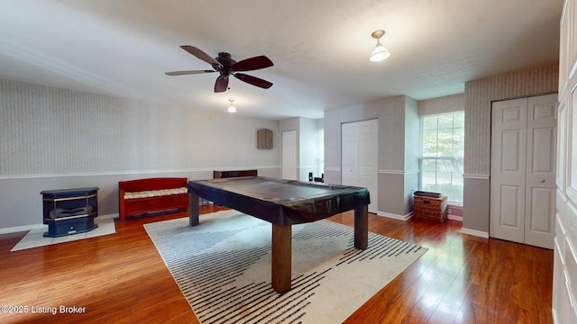 512 Valley College Dr, Louisville, KY 40272 - playroom featuring wallpapered walls, a wood stove, baseboards, wood finished floors, and billiards
