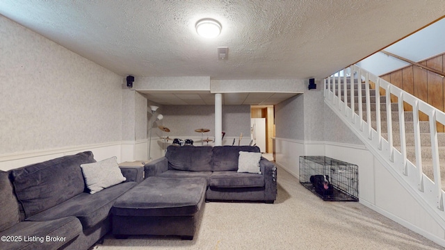 512 Valley College Dr, Louisville, KY 40272 - living area featuring wainscoting, a textured ceiling, carpet, and stairs