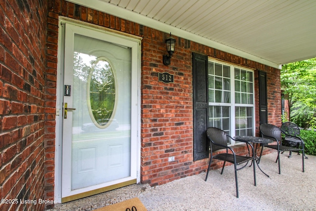 512 Valley College Dr, Louisville, KY 40272 - doorway to property featuring a porch and brick siding