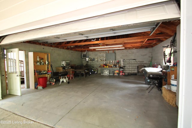 512 Valley College Dr, Louisville, KY 40272 - garage featuring concrete block wall