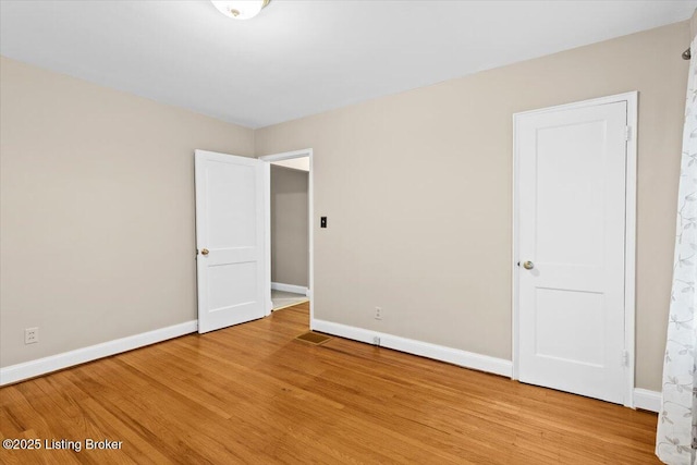 3306 Grandview Ave, Louisville, KY 40207 - unfurnished bedroom featuring baseboards and light wood-style flooring