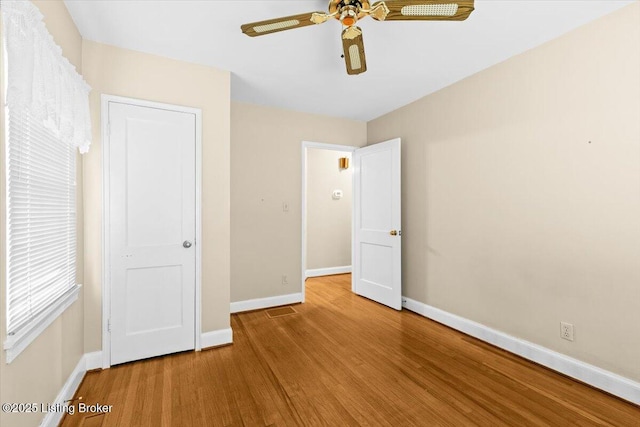 3306 Grandview Ave, Louisville, KY 40207 - unfurnished bedroom featuring wood finished floors and a ceiling fan