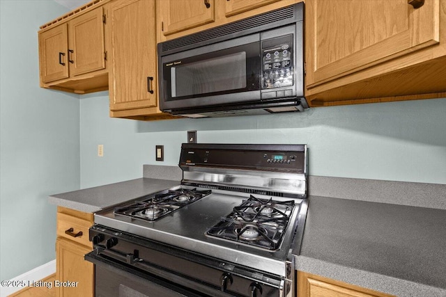 3306 Grandview Ave, Louisville, KY 40207 - kitchen featuring range with gas cooktop and black microwave
