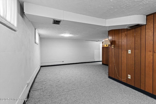 3306 Grandview Ave, Louisville, KY 40207 - finished below grade area with a textured ceiling, carpet flooring, and wooden walls