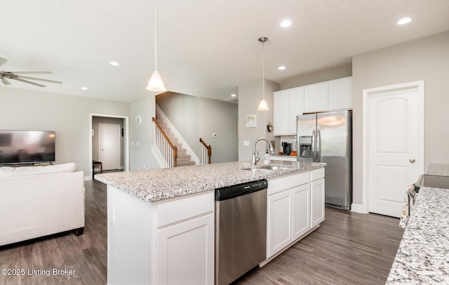17121 Piton Way, Louisville, KY 40245 - kitchen featuring appliances with stainless steel finishes, a sink, dark wood finished floors, open floor plan, and white cabinetry