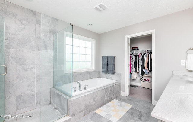 17121 Piton Way, Louisville, KY 40245 - bathroom with a shower stall, a garden tub, double vanity, a spacious closet, and baseboards