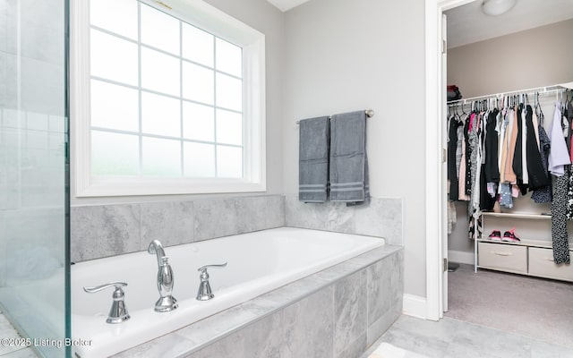17121 Piton Way, Louisville, KY 40245 - bathroom with a bath, a spacious closet, and baseboards
